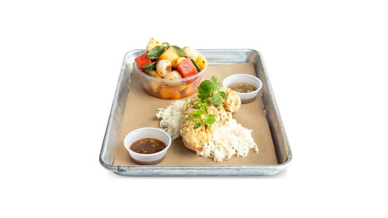 A Bird Box metal tray, including one jumbo chicken tender, jasmine rice, and your choice of side.