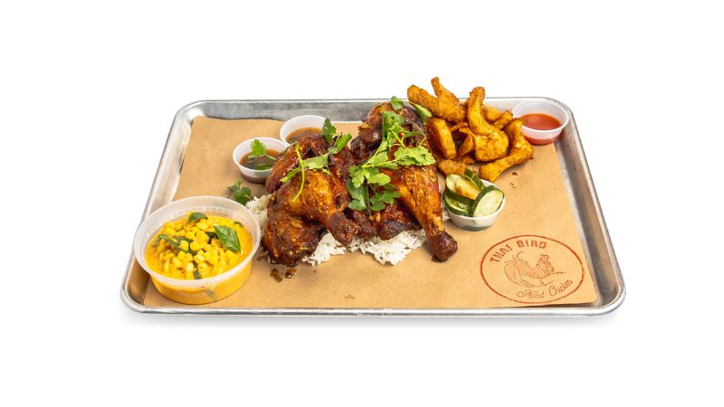 A tray of slow-cooked, juicy whole rotisserie chicken, with hints of lemongrass, coriander, and garlic.