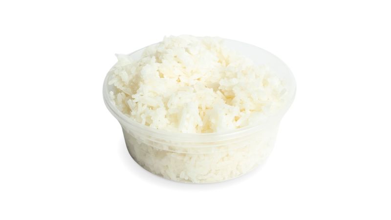 A cup of steamed white Jasmine rice.