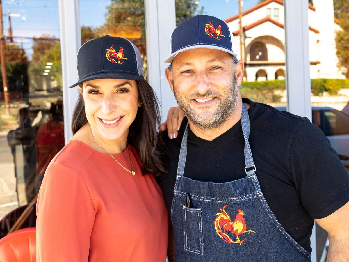 A portrait of David Gilbert and Kristin Alvarez standing in front of the Thai Bird Alamo Heights restaurant
